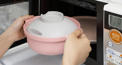 Pink Microwave cookware pot placed in microwave