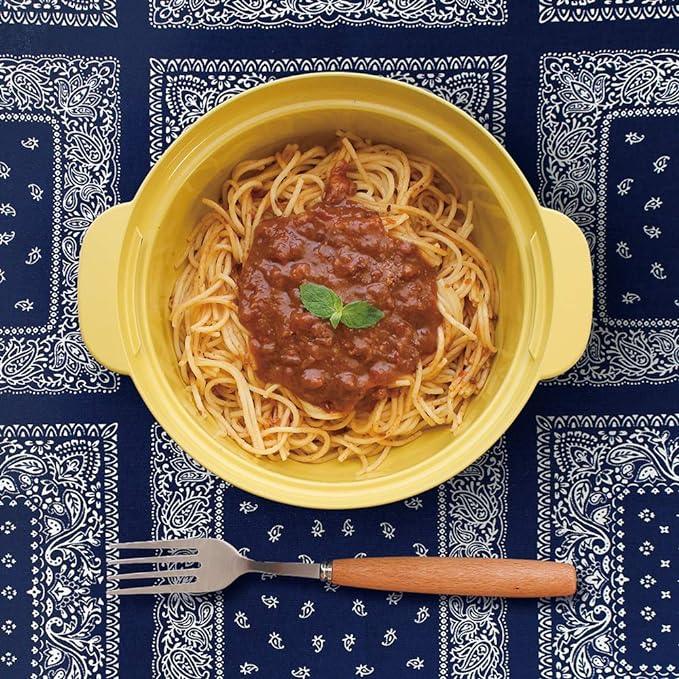 Spaghetti cooked in yellow microwave cookware pot