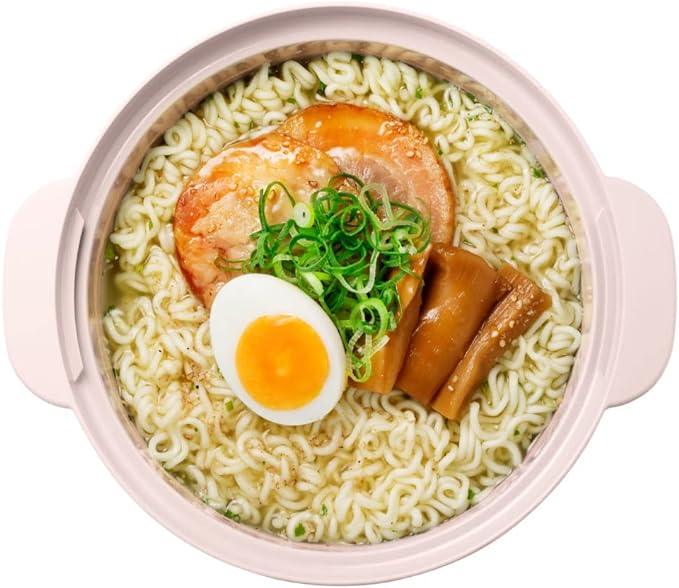 Instant ramen with toppings in pink microwave cookware pot