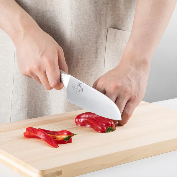 KAI Sekimagoroku Shousou All-Stainless Steel Santoku 165mm Kitchen Knife chopping red peppers