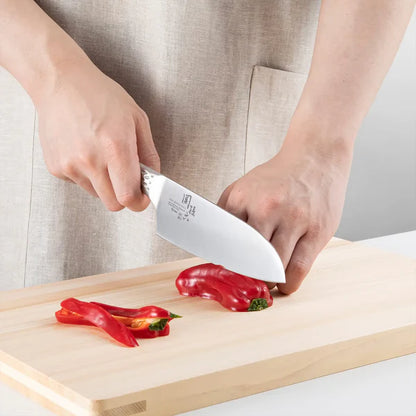 KAI Sekimagoroku Shousou All-Stainless Steel Santoku 165mm Kitchen Knife chopping red peppers